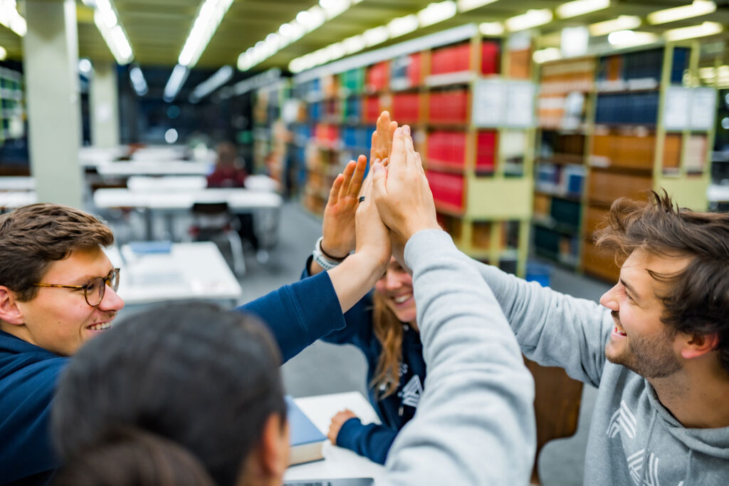 People giving each other a high five.